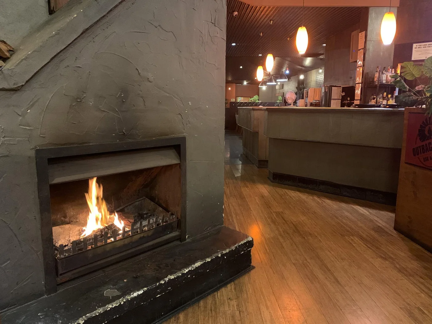 The open fireplace and bar inside Outback Jacks Northbridge