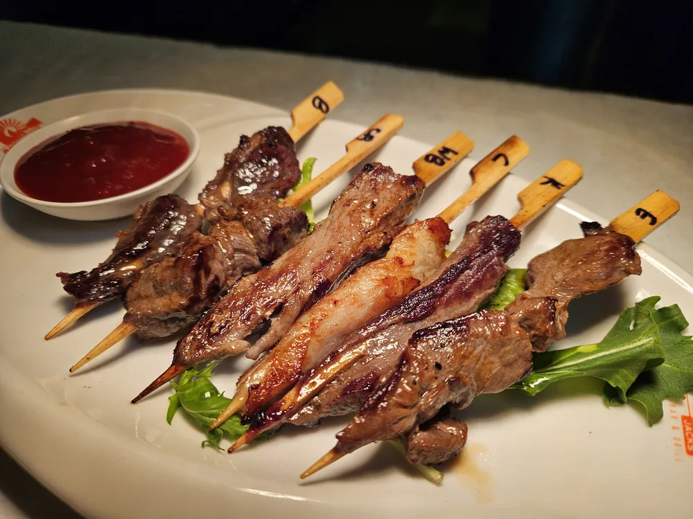 Jack's Game Sampler Skewers - six labelled skewers of kangaroo, crocodile, emu, buffalo, camel and wild boar with dipping sauce